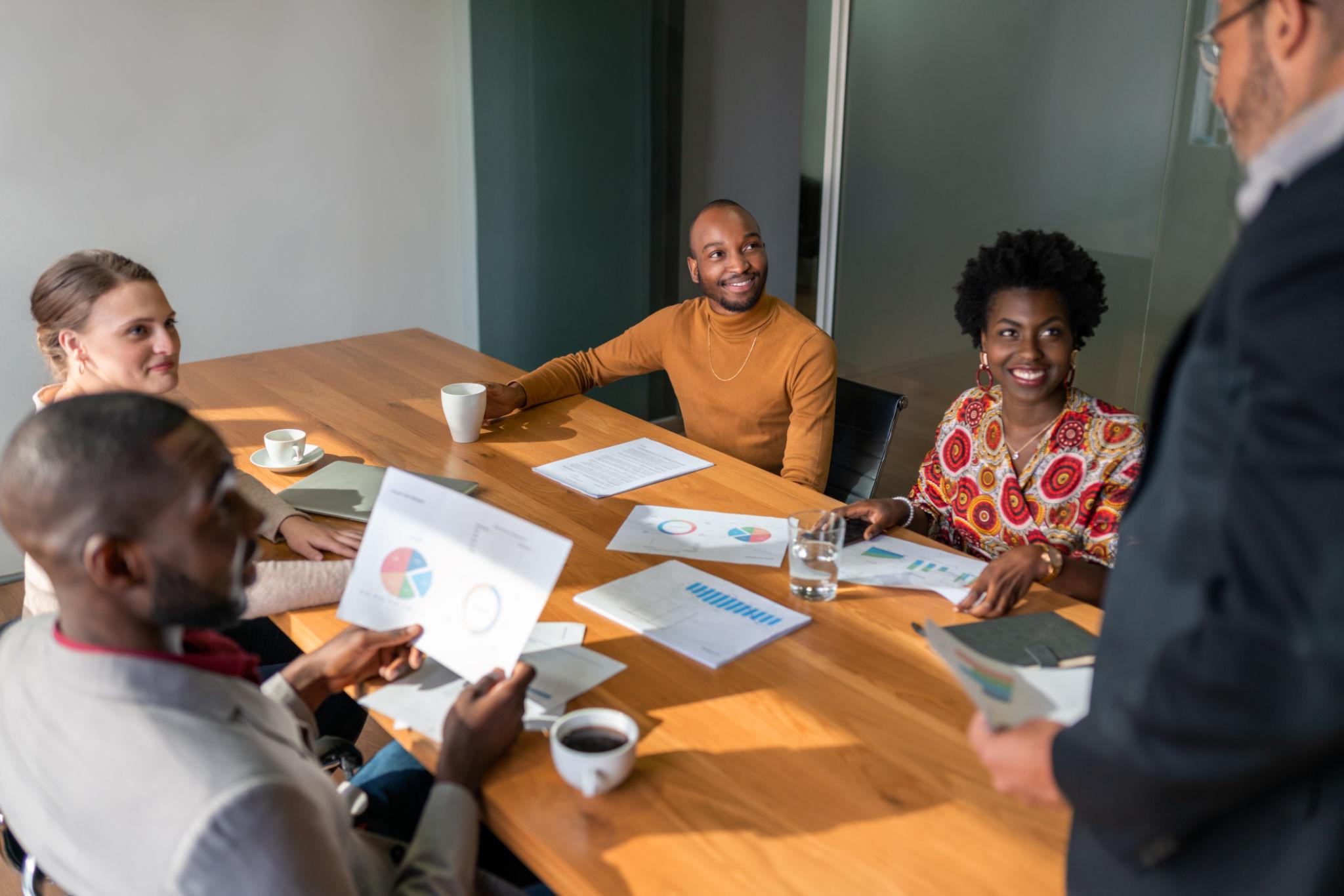 Diverse Publix Entreprise team in a boardroom discussion